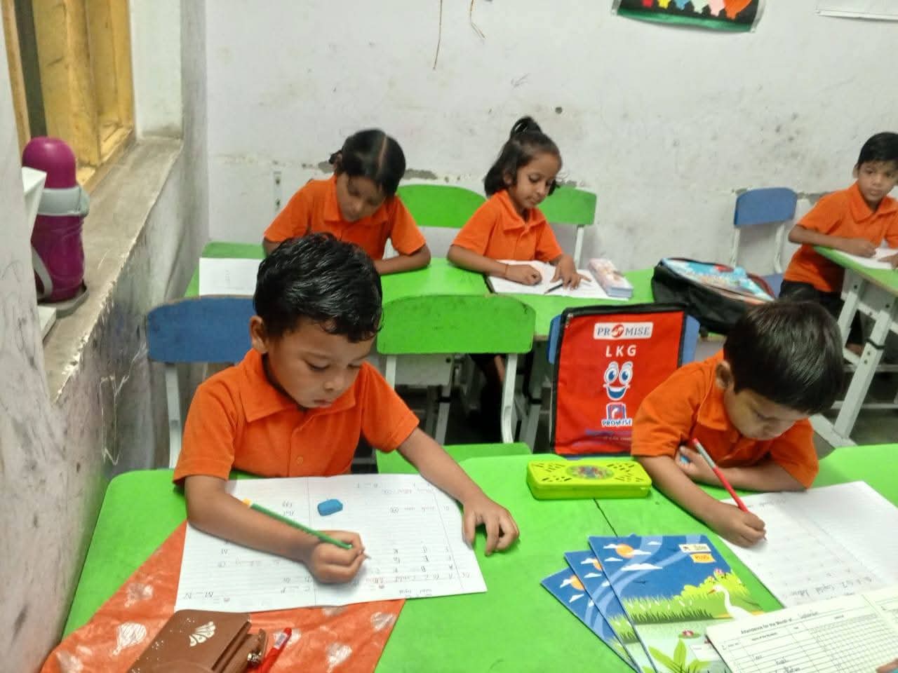 Vidhya Peeth children studying diligently at green desks